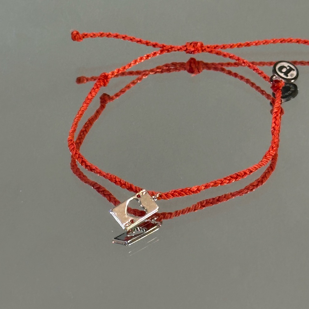 Pura Vida Silver Heart Lock Charm on Red braided Cord bracelet.